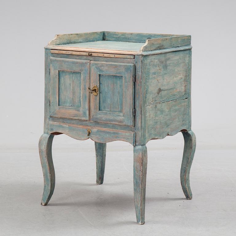 A 18th century rococo bedside table.