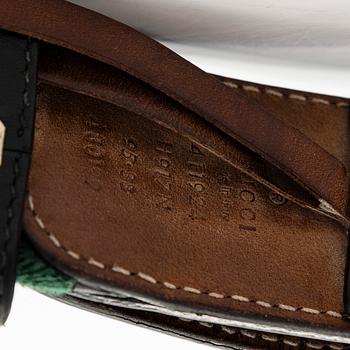 Gucci, A 'Verbier' scarf and a belt.