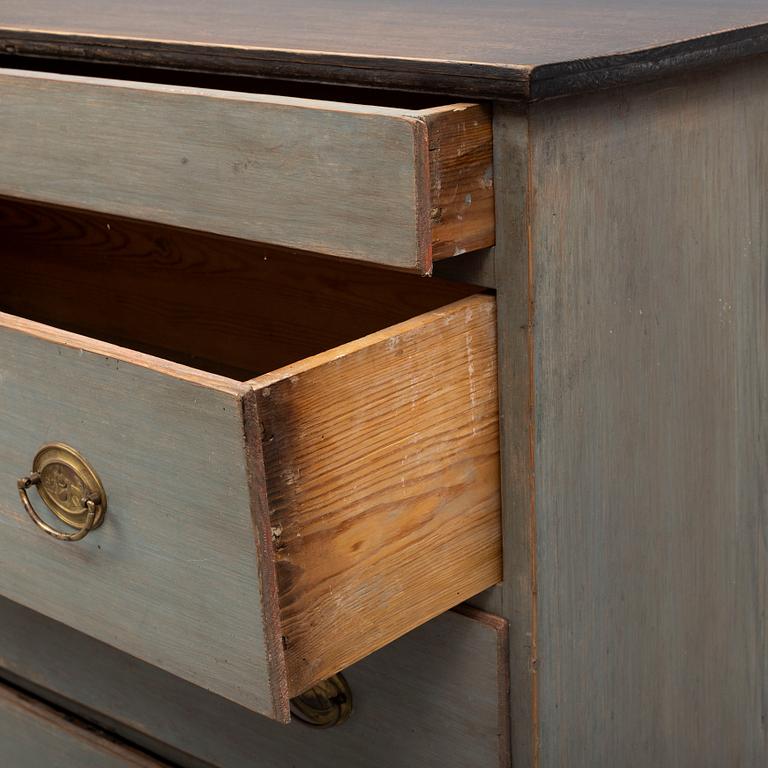 a chest of drawers from the first half of the 19th century.