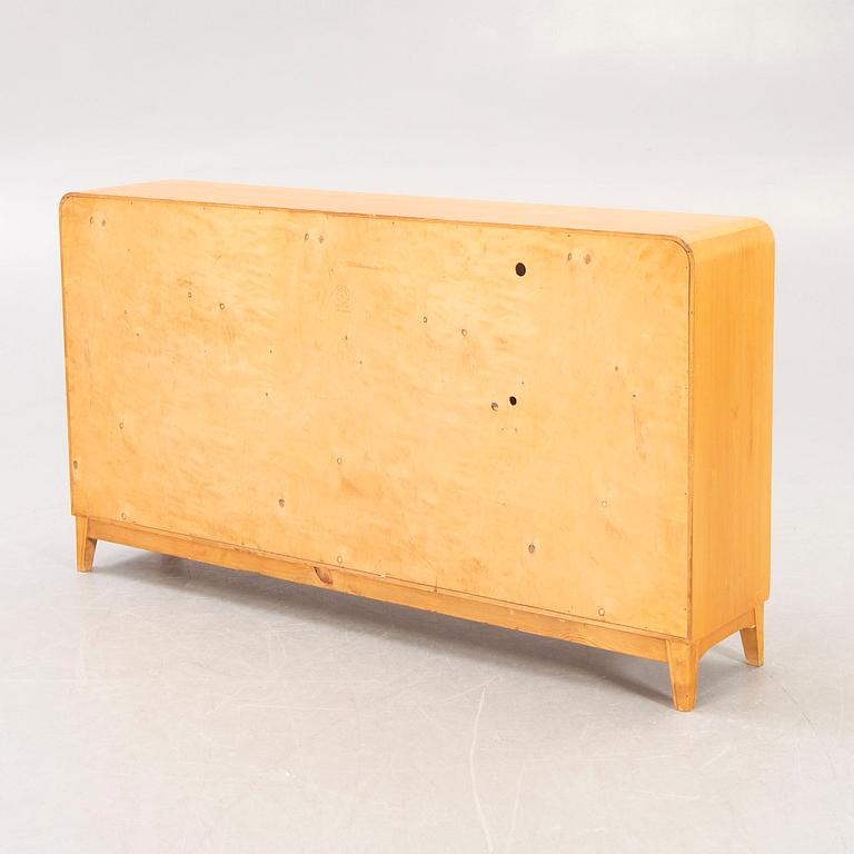 A 1940s birch book shelf.