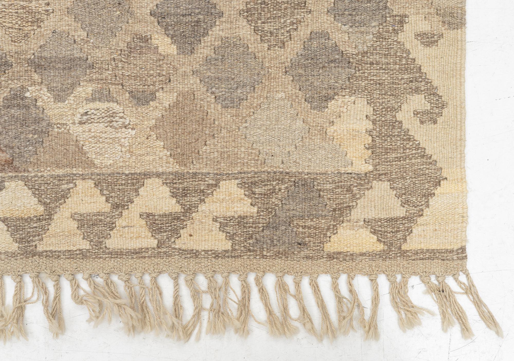 A kilim rug, c. 200 x 200 cm.