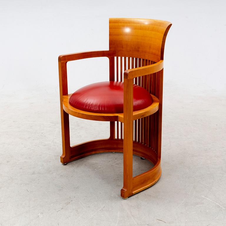A cherry wood model 606 'Barrel' chair by Frank Lloyd Wright from Cassina.