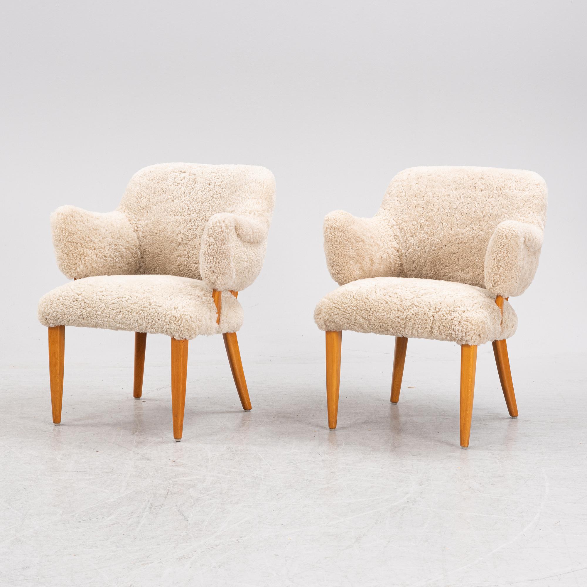 A pair of 'Lilla Sällskapet' armchairs by Carl Malmsten, second half of the 20th Century.