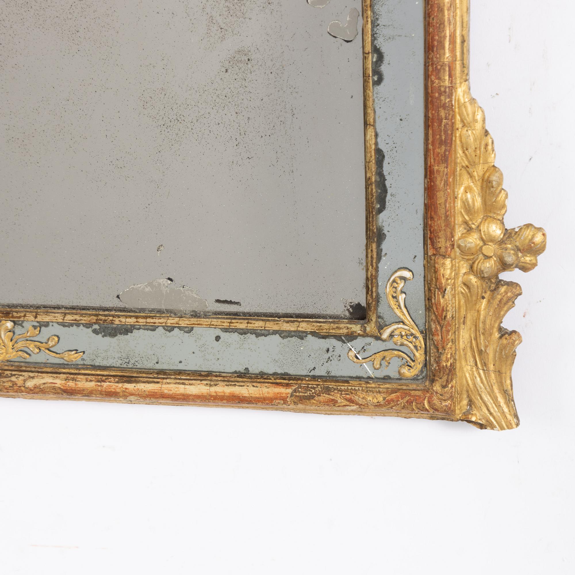 A rococo mirror, second part of the 18th Century.