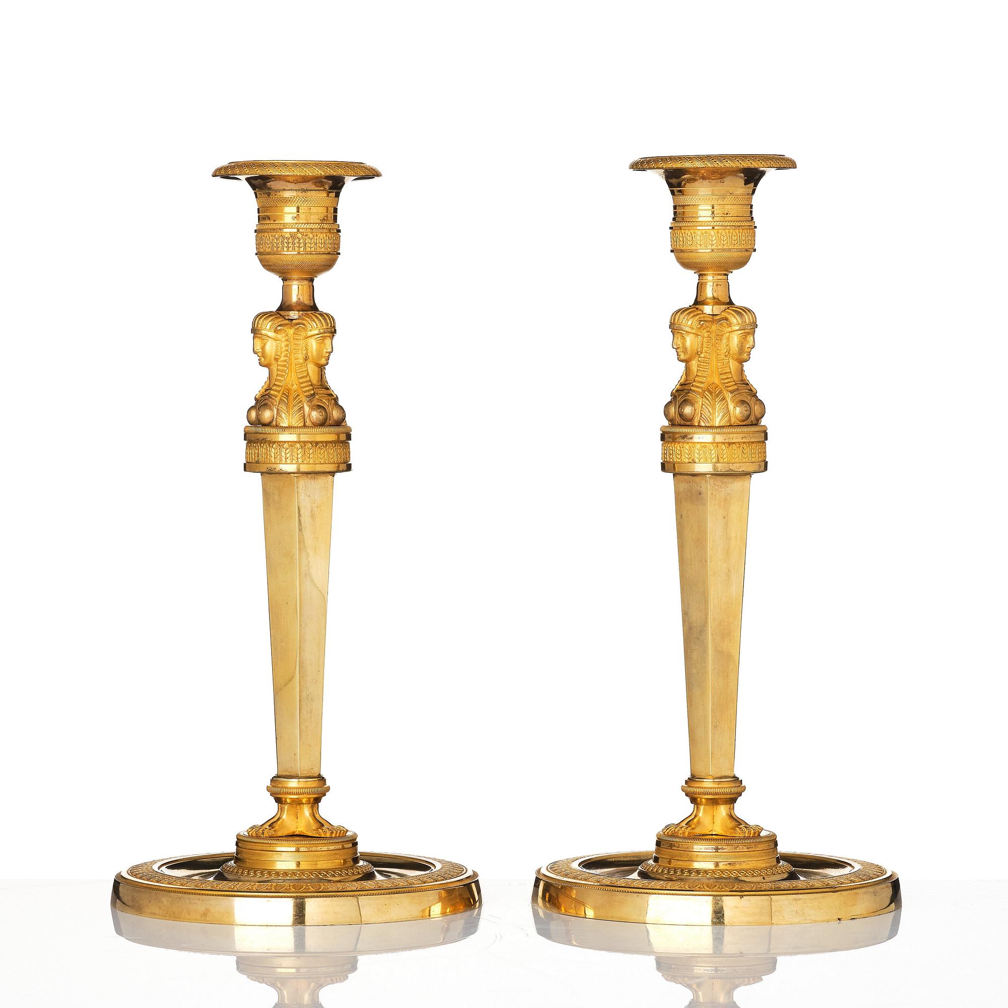 A pair of French Empire candlesticks, early 19th century.