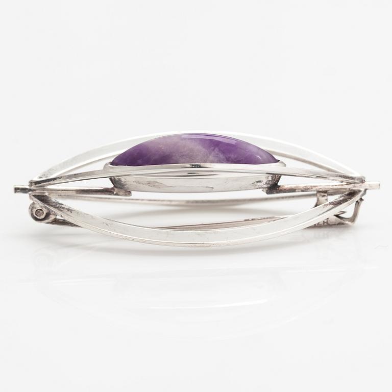 Elis Kauppi, A silver brooch/pendant with an amethyst. Kupittaan kulta, Turku 1961.