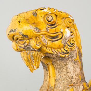 A yellow glazed fragment of a rooftile, Ming dynasty (1368-1644).