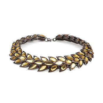 447. YVES SAINT LAURENT, a metal and glass necklace.