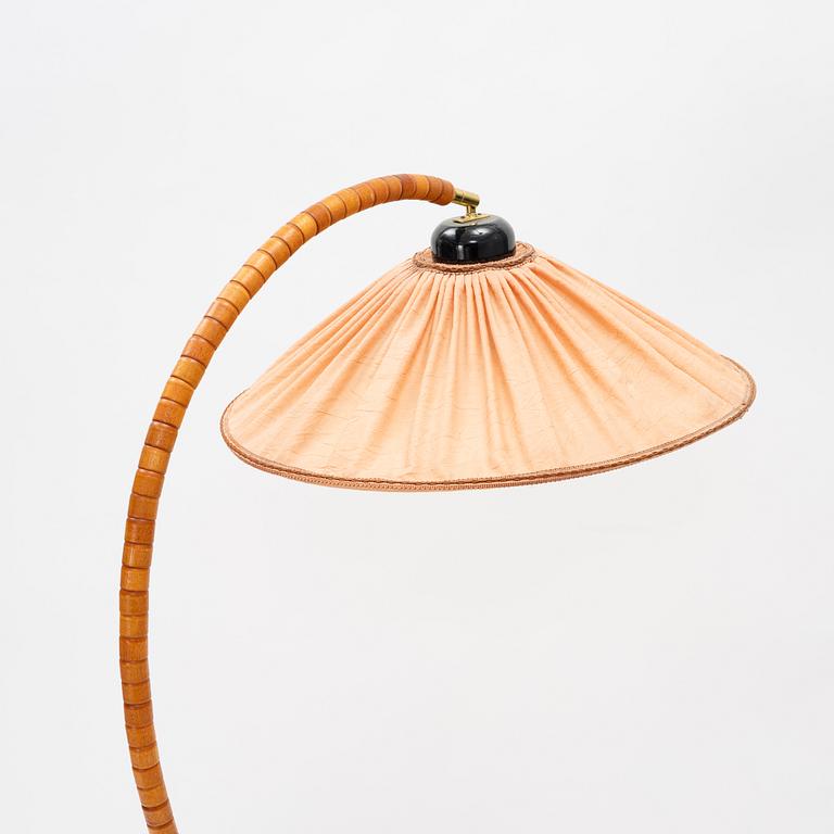 A stained beech floor light, Markslöjd, late 20th Century.