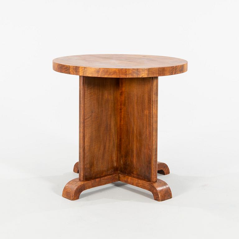 An Art Déco-style walnut table, manufactured in modern times.