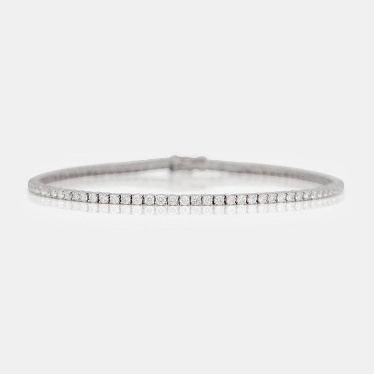 A brilliant-cut diamond line bracelet. Total carat weight of diamonds circa 2.70cts.