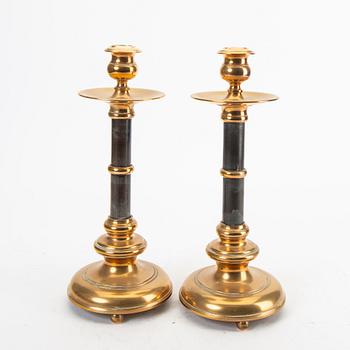 A pair of brass and wood candle sticks early 1900s.