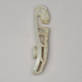 A nephrite belt hook and object, presumably late Qing dynasty, circa 1900.