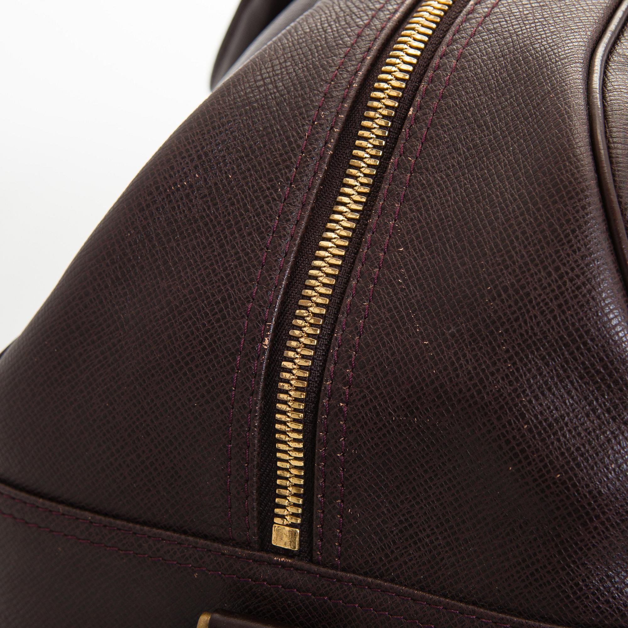 Louis Vuitton, a 'Taiga Kendall PM' weekend bag.