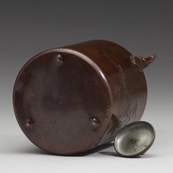 A Japanese copper alloy tea pot with cover, late Edo period (1603-1868).