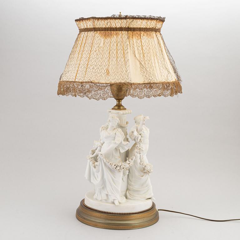 A parian and metall table lamp, first half of the 20th century.