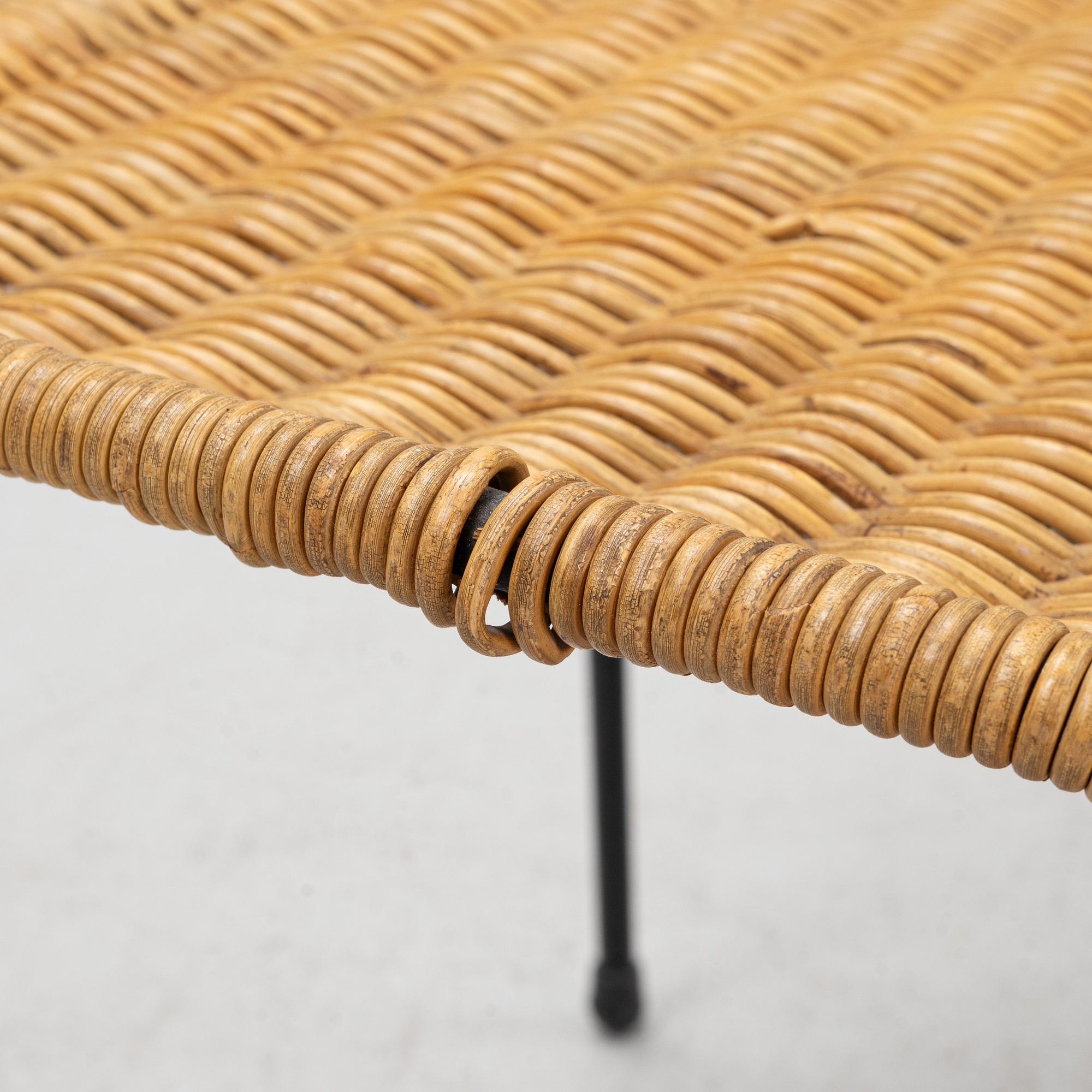A rattan chair with ottoman, 1950's.