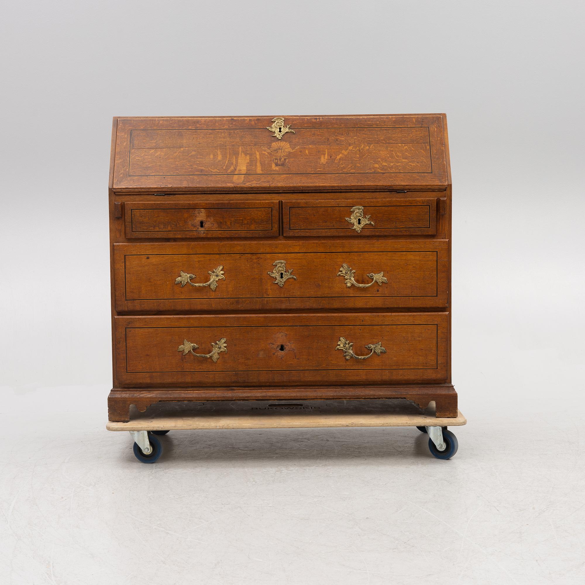 An oak secretaire, first half of the 19th century.