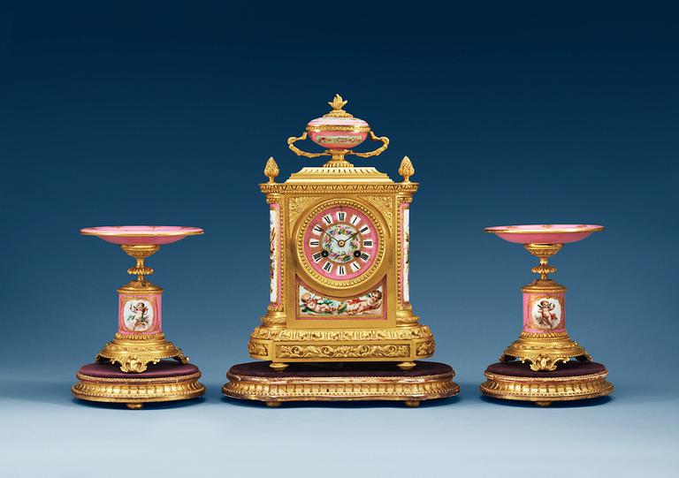 A three piece gilt-bronze clock garniture, by Charles Fredrick Wassel, 43 Frenchurch Street, London ca 1869.