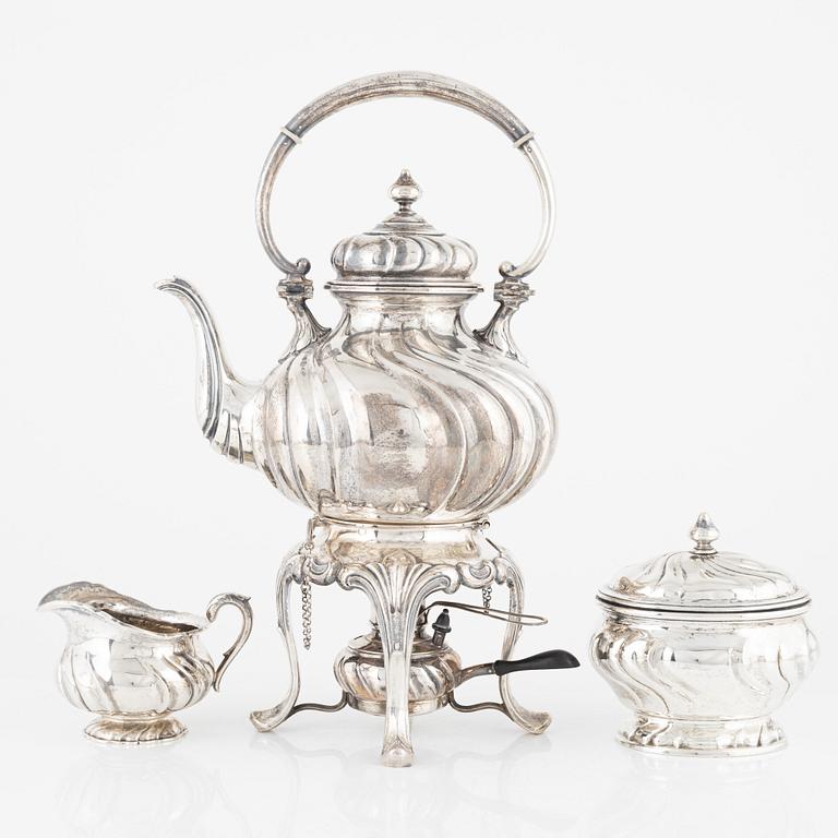 A Swedish 20th century silver tea-urn with stand and burner, creamer and sugerbowl, Stockholm 1918-1920.