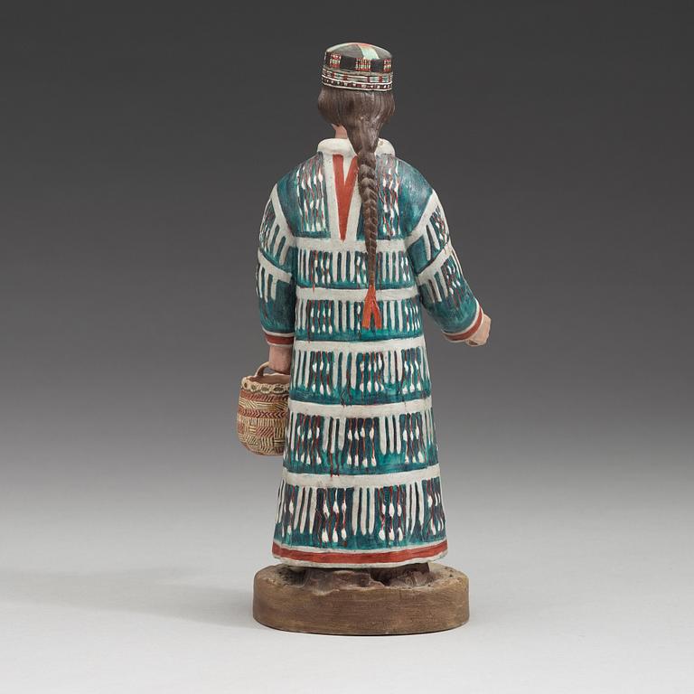 A Russian biscuit figure of a man of the Aleut people, circa 1900.