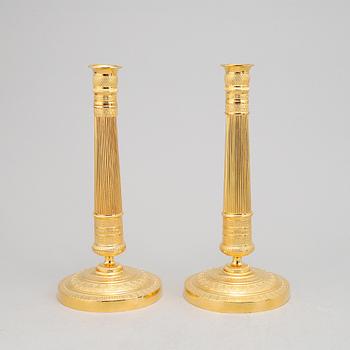 A pair of french Empire candlesticks, first half of the 19th Century.