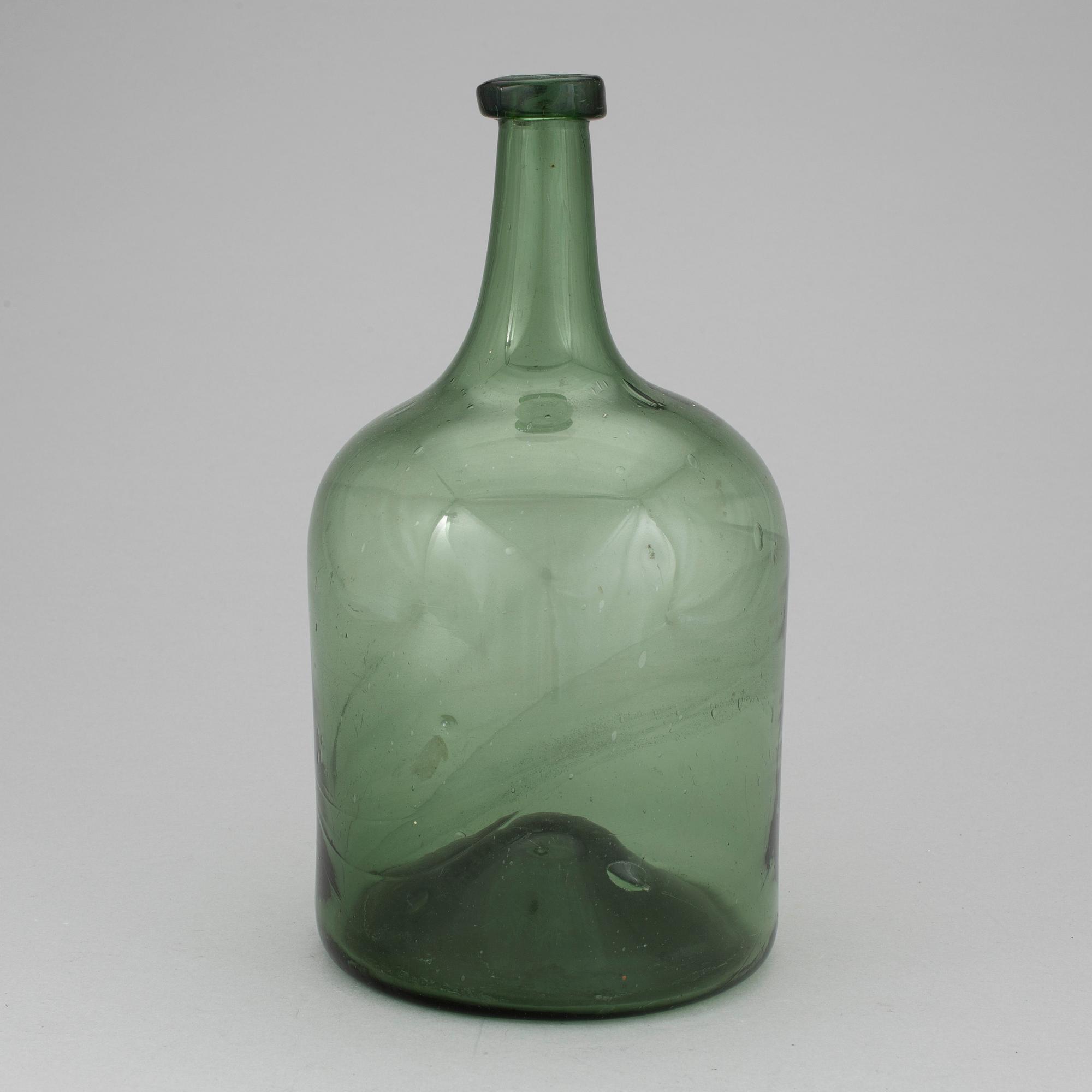 A 18th or 19th century glass bottle.
