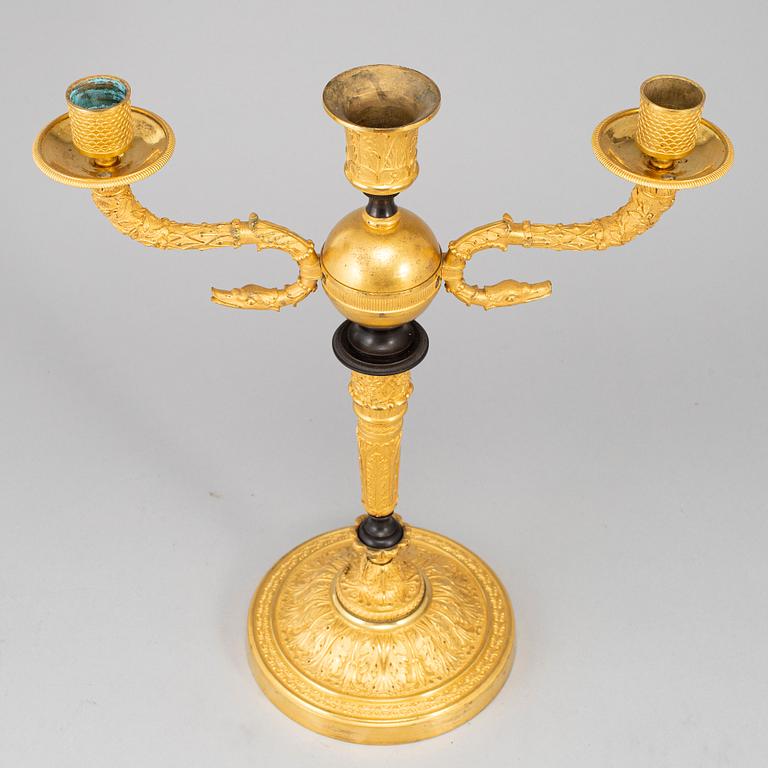 An empire ormolu candelabrum, early 19th century.