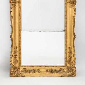 A Rococo style mirror, late 19th Century.