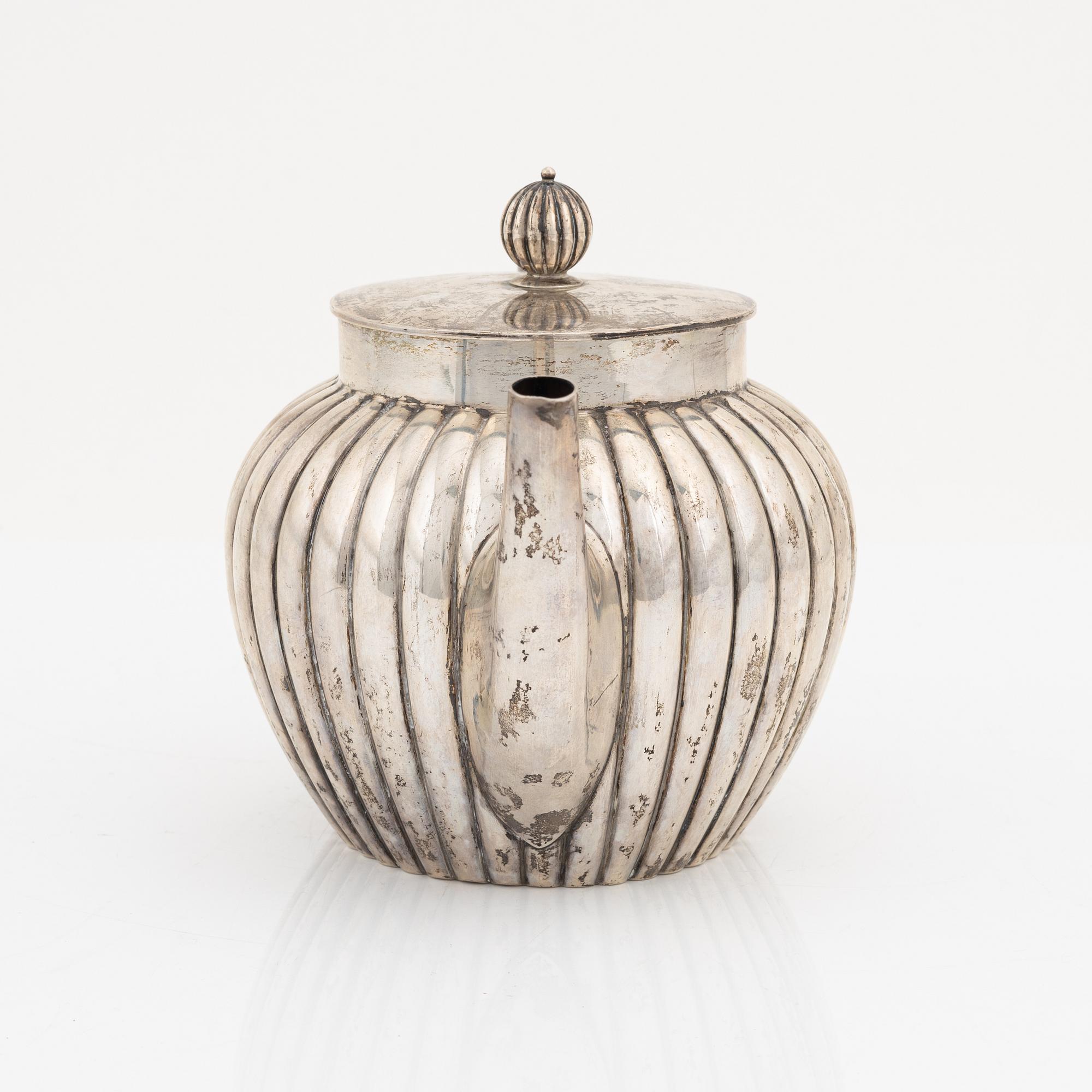 A silver teapot, bearing the mark of K. Andersson, Stcokholm, 1905.