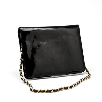 CHANEL, a black patent leather flap bag.