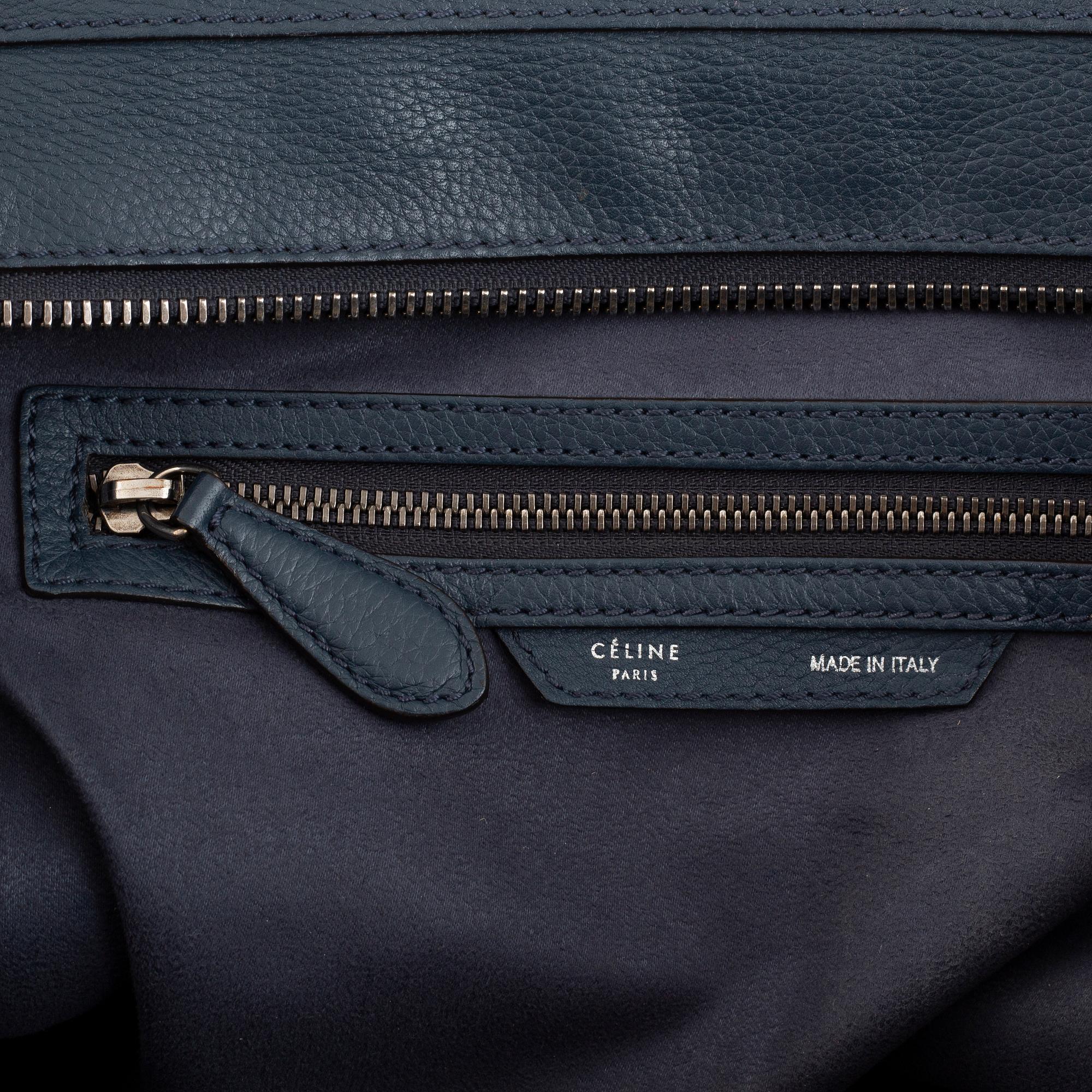 Céline, a teal leather 'Luggage' handbag.