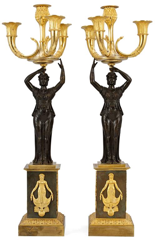 A pair of Empire four-light candelabra.