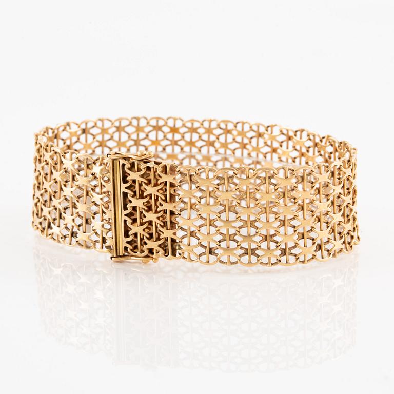 Armlänk, 18K guld, x-länk,  Ädelsmycken  AB, Stockholm 1969.