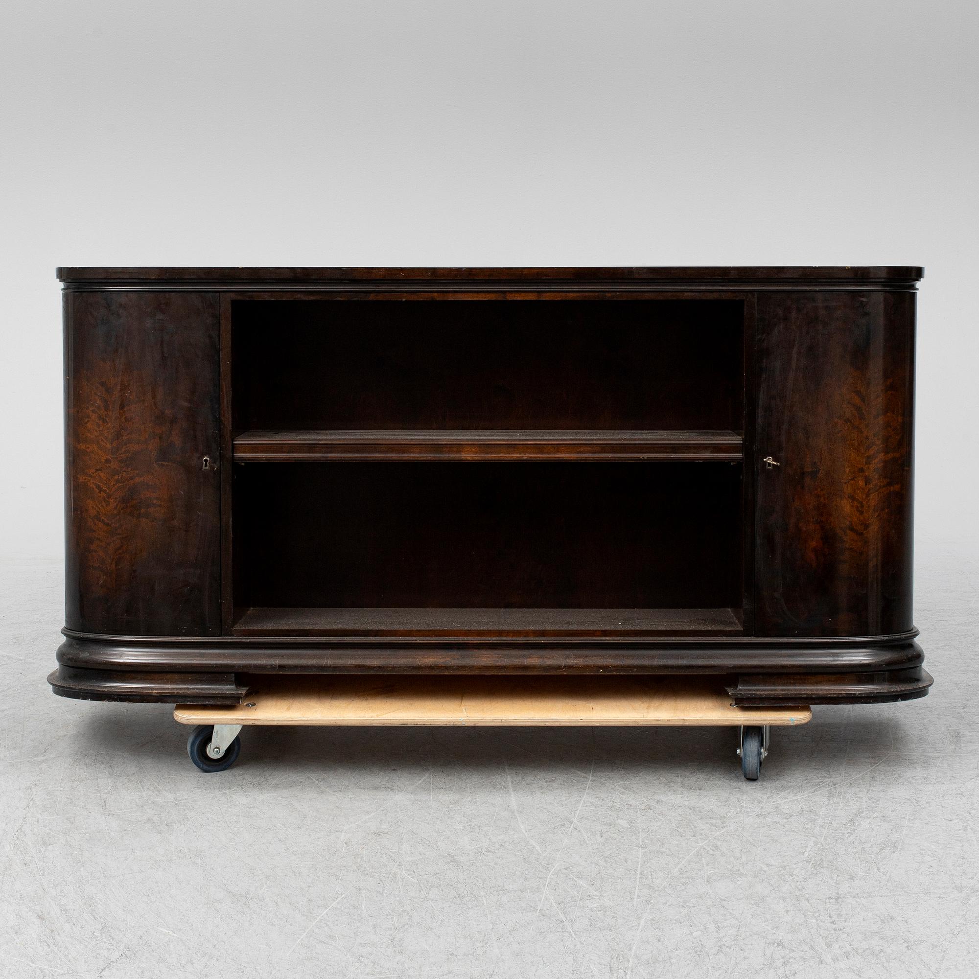 A 1930s stained birch shelf.