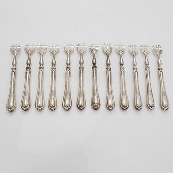 A set of twelve Belgian silver oyster forks.