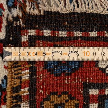 An antique Kurdish runner, probably,. 406 x 105 cm.