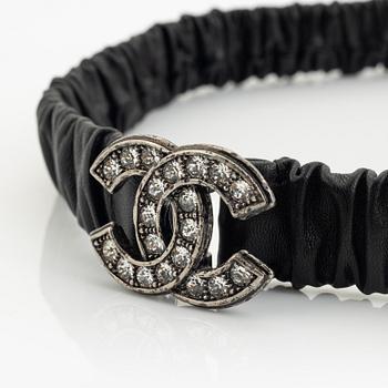 Chanel, a leather and rhinestone belt.
