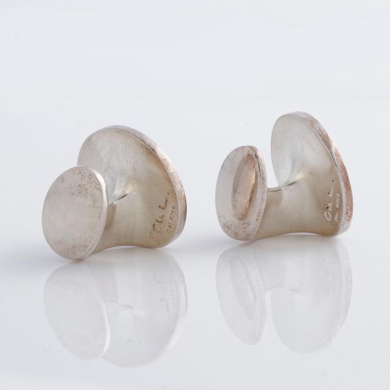 A pair of cufflink, by Ole Lynggaard.