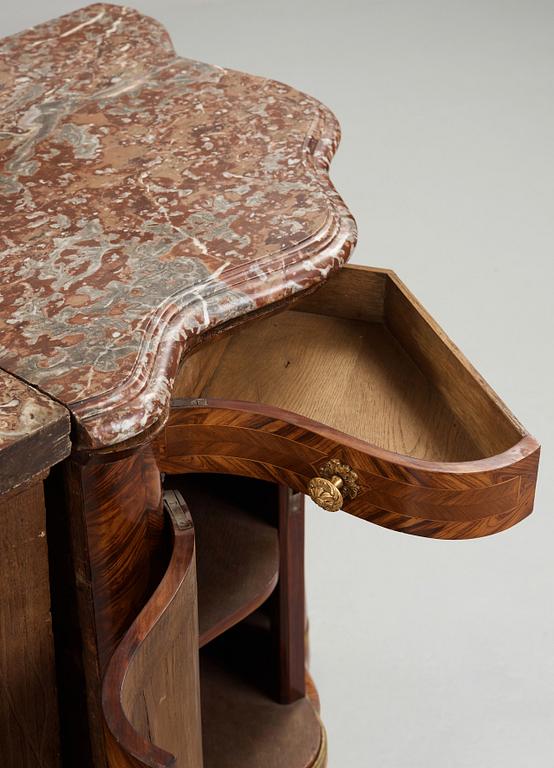 A pair of Louis XV 18th century corner cupboards.