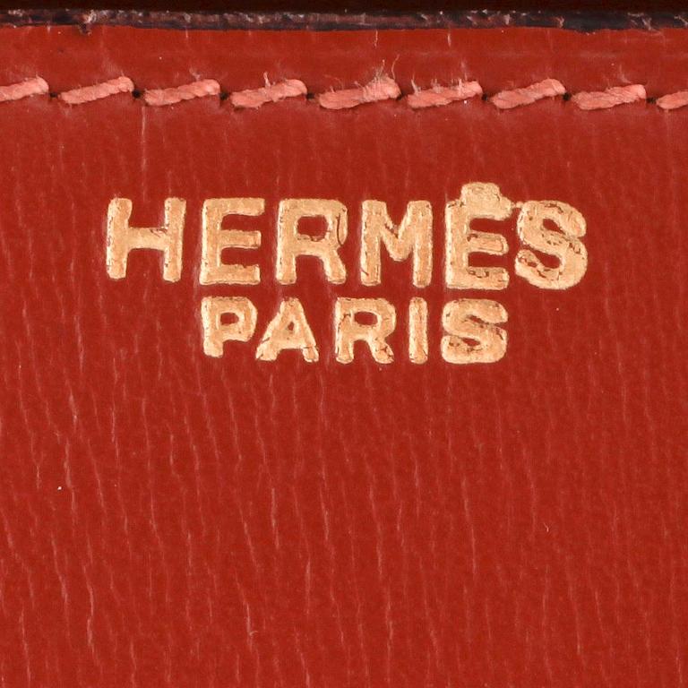 HERMÈS, a brown leather handbag.