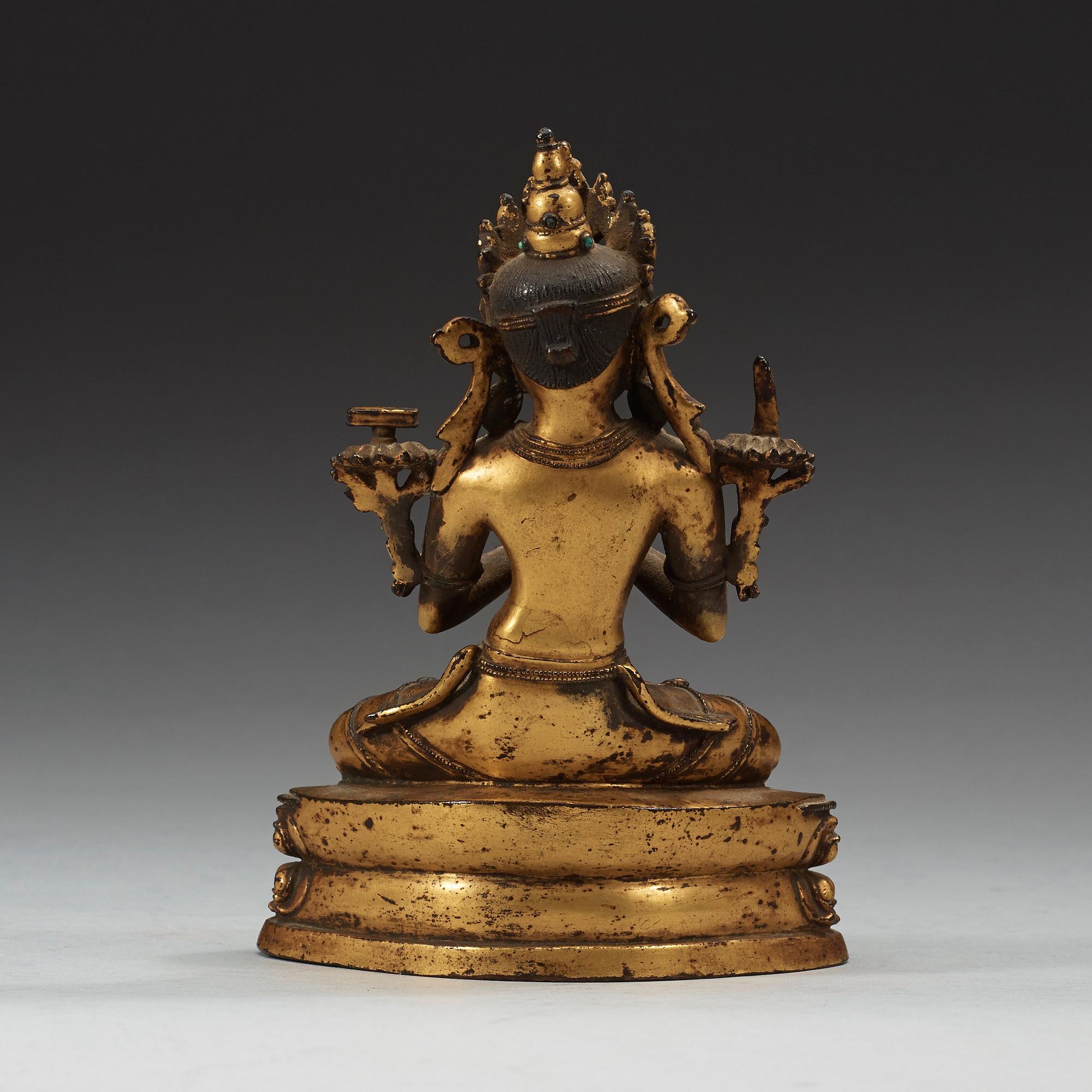 A gilt copper alloy figure of Manjushri, Nepal 15th/16th Century.