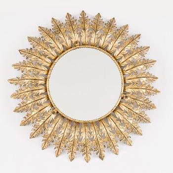 A mid 20th century metal sun mirror with lights.