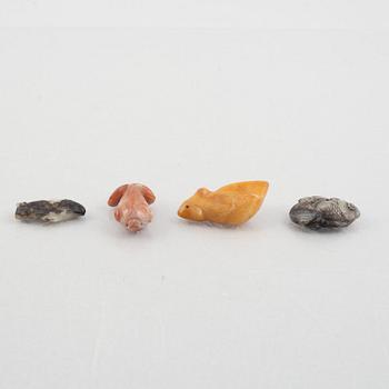 A group of eight Chinese stone charms / pendants, 20th century.