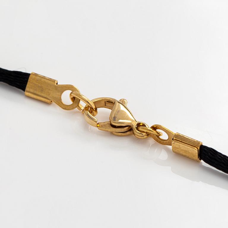 Cartier, necklace/pendant, "Trinity", 18K tricolour gold with black silk cord.
