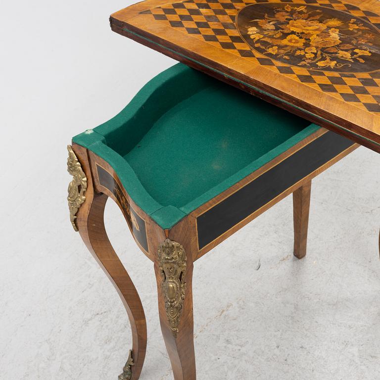 A Louis XV-style games table, early 20th century.