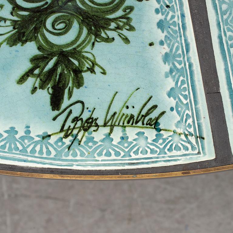 BJÖRN WIINBLAD, a ceramic and metal table, signed.