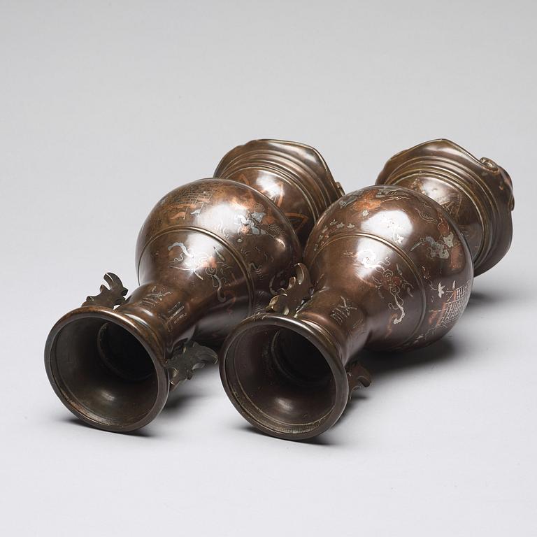 A pair of bronze vases with copper and silver inlay, Qing dynasty (1664-1912).