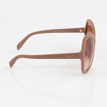 Prada, a pair of coral pink color sunglasses.