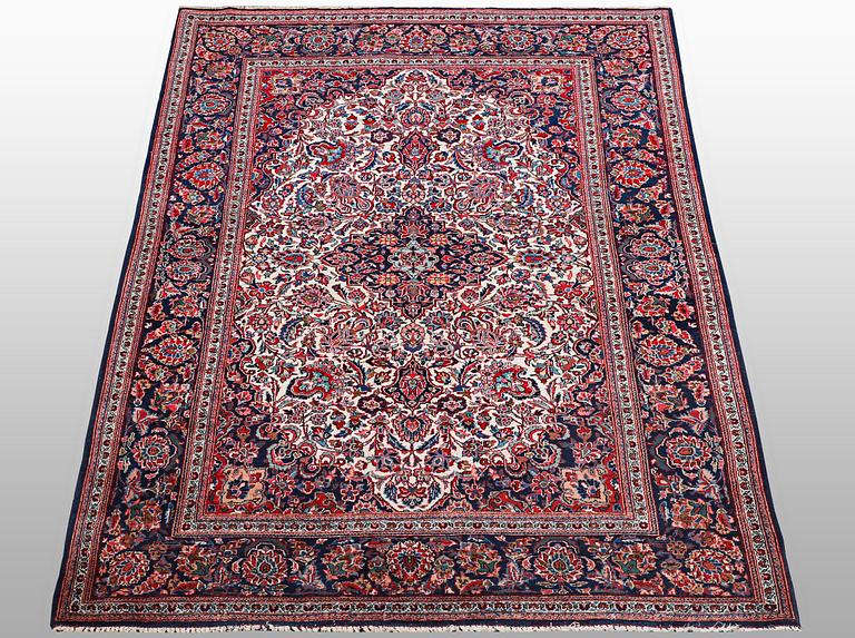 A rug, semi-antique Keshan, 217 x 134 cm.